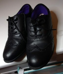 A pair of black school shoes
