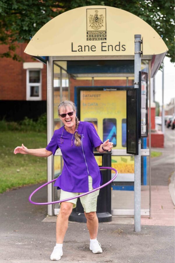 Potty Purple Podiatrist Warrington - Hula hooping at bus stop